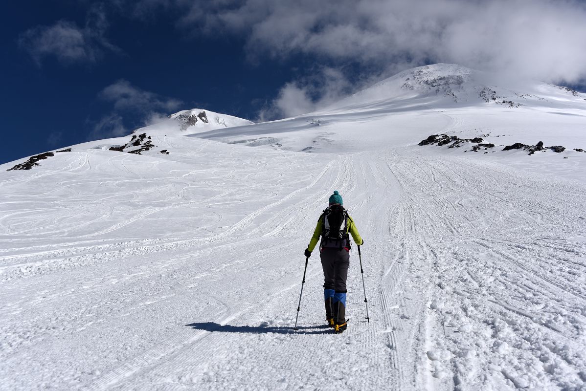 04A My Guide Liza Pahl Leads The Way On The Climb To Pastukhov Rocks With Mount Elbrus West And East Summits Above